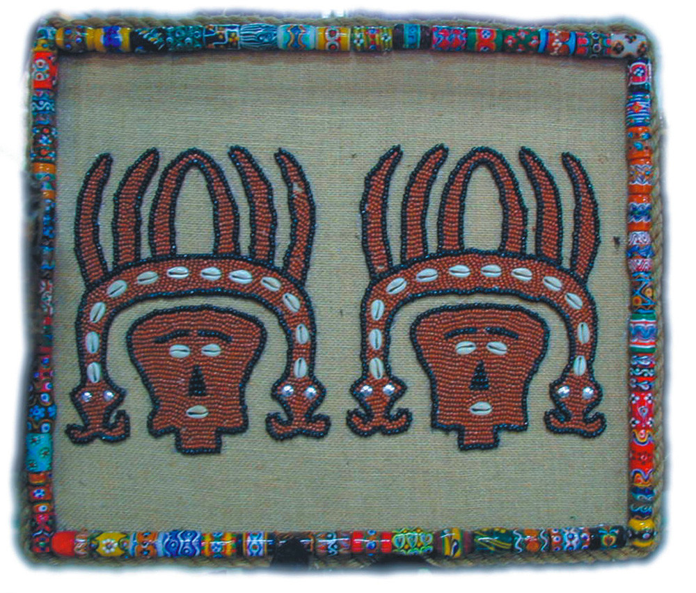 The glass beads are initiatively used to frame the embroidery.