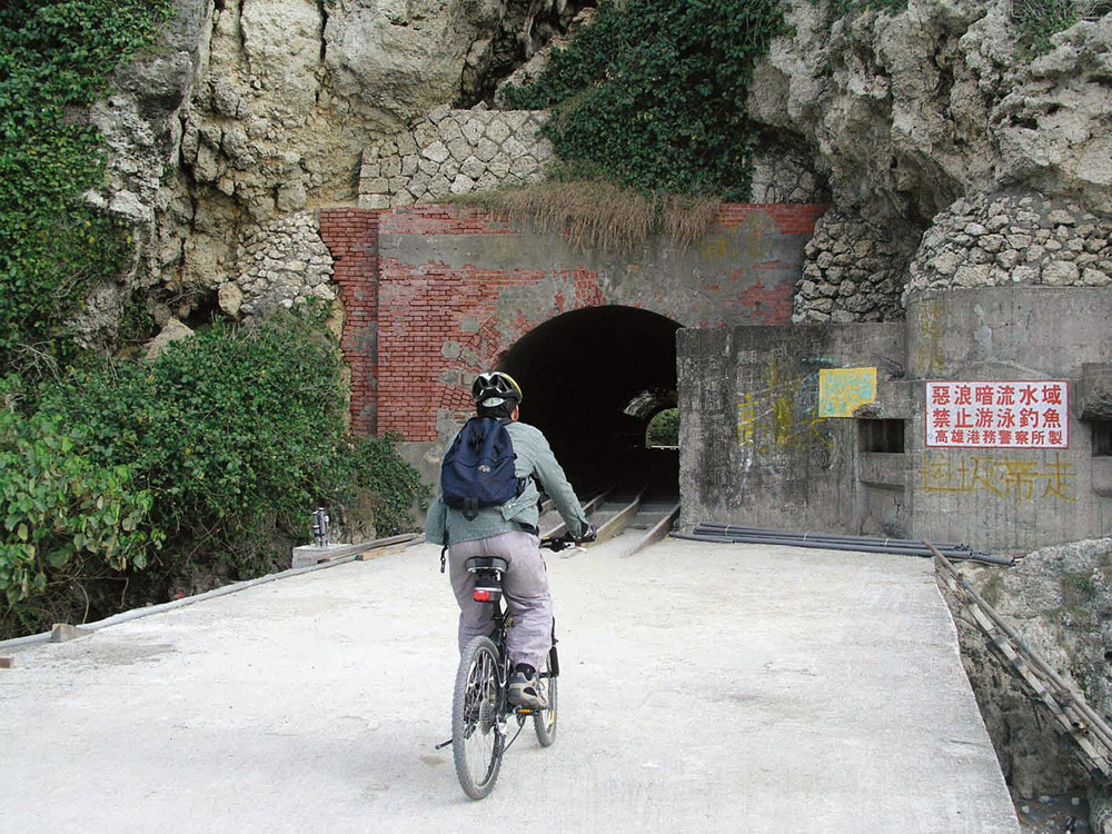 Visitors are pedaling and taking in the fantastic views with the beach on one side and the tree lined coral cliffs, on the other.