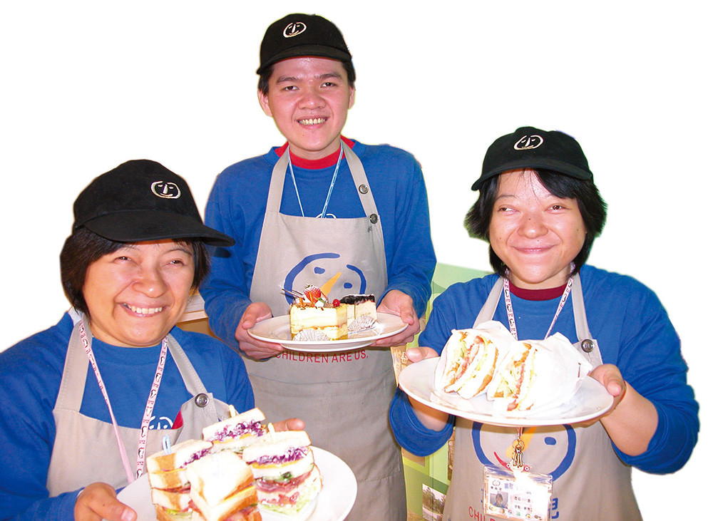 The children greet guests with angelic smiles and delicious pastries at the \"Children are Us Bakery Restaurant.\"