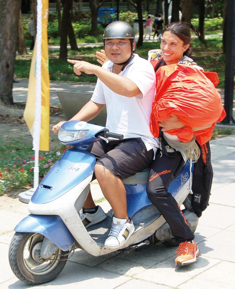 The story of Mr. Tsai helping French parachutist Vincent Reffet return to the venue on a scooter even made the New York Times.