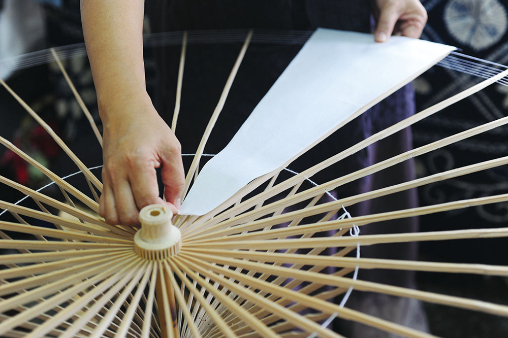 The meticulous process in making paper umbrellas