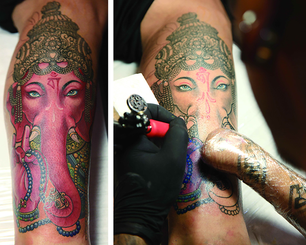 Yang tattooing a client
